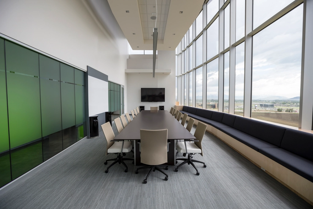 Empty boardroom table with chairs, representing a governance council